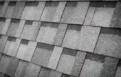 Grey architectural shingles, close up.