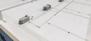 A white heat-welded TPO membrane roof seen from above.